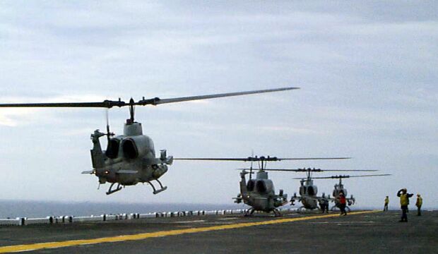 Image: U.S. Marine Corps AH-1W Super Cobra helicopters land aboard the USS Wasp.