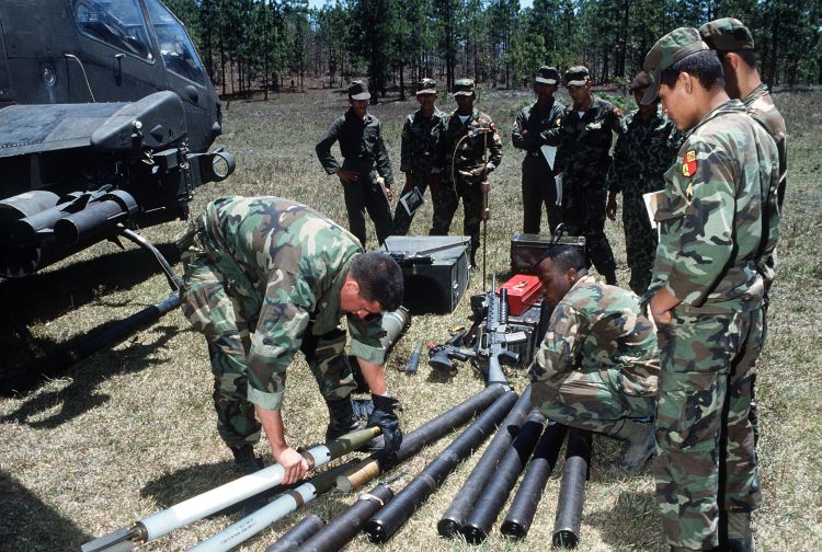 Image: AH-1F being loaded with 2.75 inch rockets.