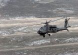 Image: An AH-64 Apache flies to its firing position at the Glamoc Firing Range.