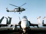 Image: Explosive Ordnance Disposal team rappel from an SH-60B Seahawk helicopter.