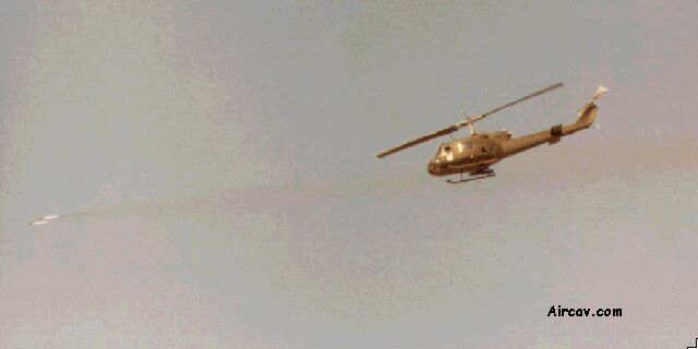 Image: UH-1M launching a pair of 2.75 inch rockets